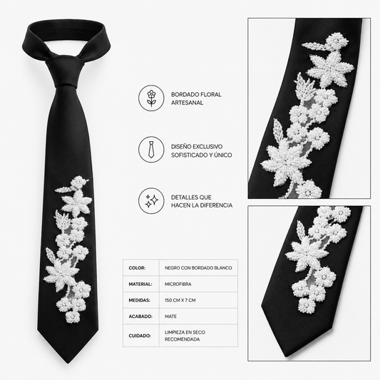 Corbata negra artesanal con bordado floral blanco realizado a mano. Diseño exclusivo de Paola Santos.